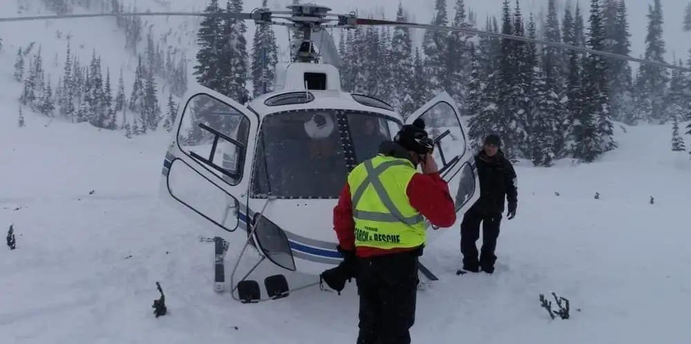 Members probing an avalanche debris field